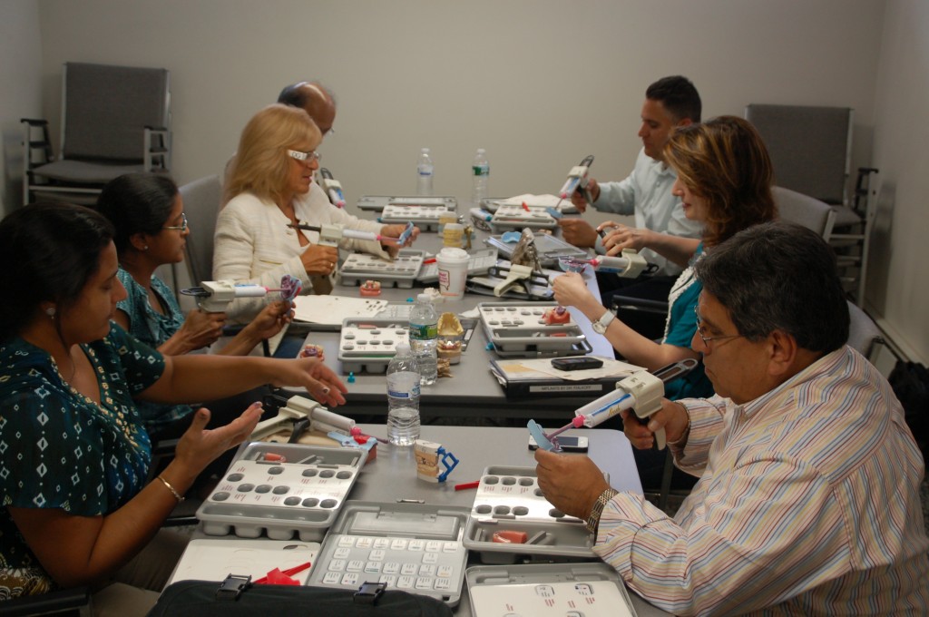 People working on creating implants during one of Dr. Fialkoff's courses