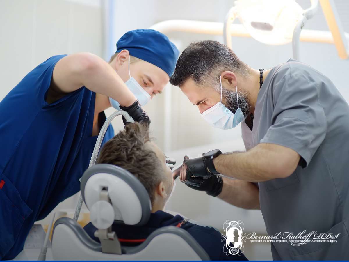 A dentist preforming dental implants work in Bayside, NY.